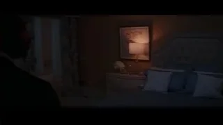 man in suit deep in thought in dark room — Creed 3
