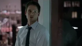 Young man in tie holding gun — Suits