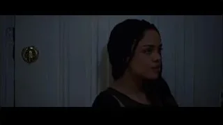 person in black hoodie by dark door — Creed