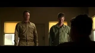 Two men conversing in dimly lit room — Hacksaw Ridge