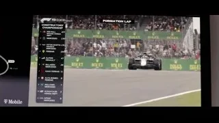 Formula 1 car on race track with crowd — F1
