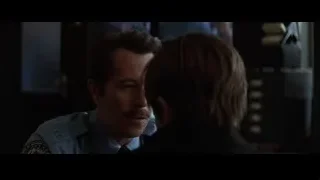 man in police uniform talking to woman — Batman