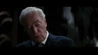 elderly man's face serious expression — Batman: The Dark Knight Rises