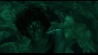 Shirtless man in dark forest — Life of Pi