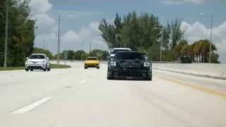 black Porsche 911 GT3 RS on race track — Sports Cars