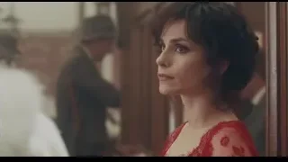 woman in red dress with serious expression — Peaky Blinders