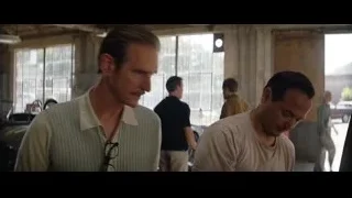 Two men talking in garage — Ford v Ferrari