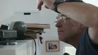 man at desk looking at computer — Elon Musk: Return to Space