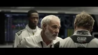 men talking in a workshop — F1