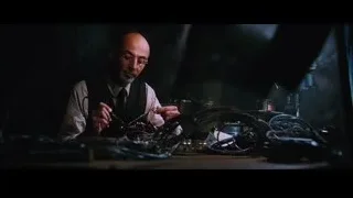 man working at desk in dark room — Iron Man