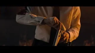 man in white shirt holding gun — John Wick: Chapter 4
